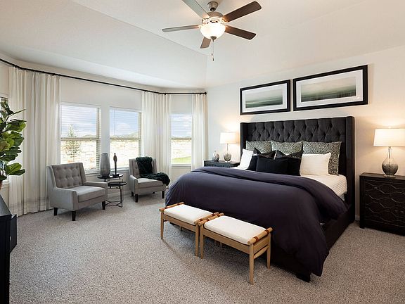 Sleep will come easy in this tranquil primary suite.
