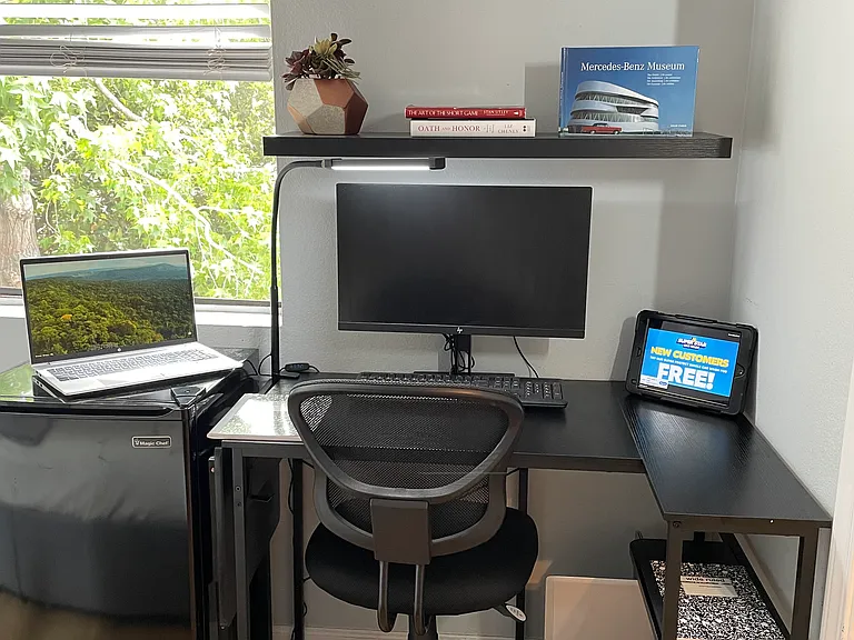 New spacious computer work-station with window view of resort setting
