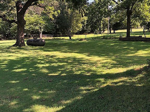 Huge backyard with trees 