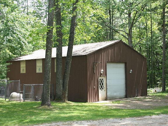 30x40 pole barn. Cement poured floor and insulated.