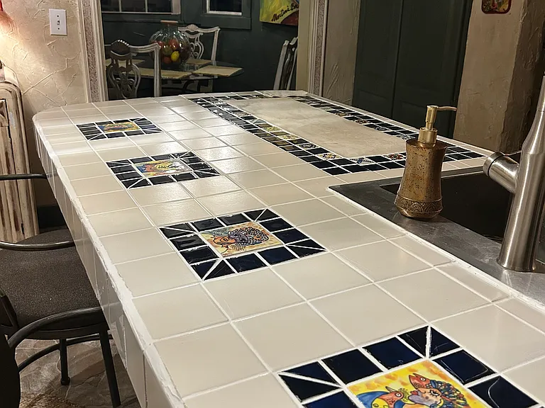 Custom tiling from southern Portugal adorns the kitchen counters