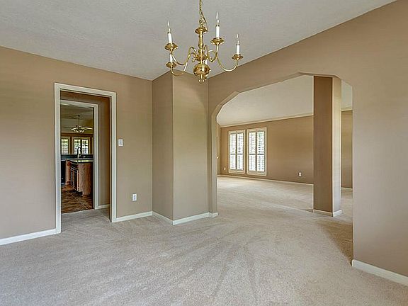 Formal dining with access to the kitchen.