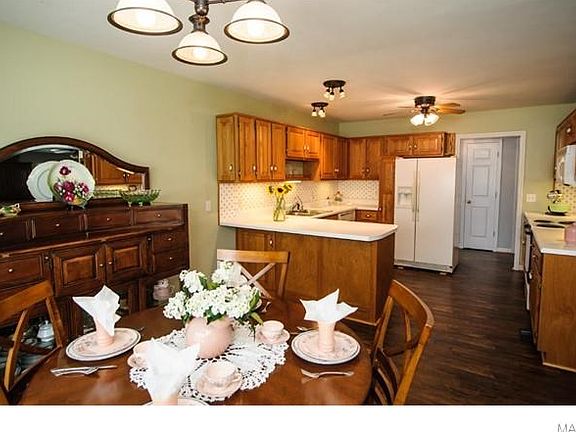 Big country kitchen for family dinners. Opens to nice sized dining area.