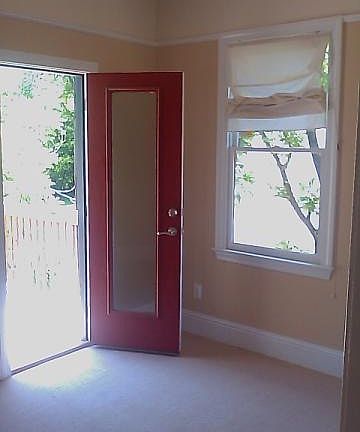 Bedroom w/ door to balcony