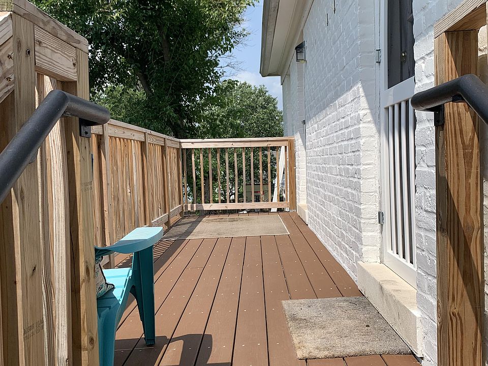 Back balcony with steps to parking lot