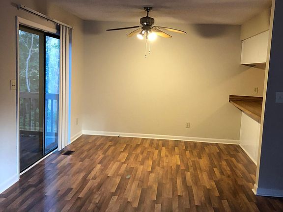 Dining room with sliding door and bar over to kitchen
