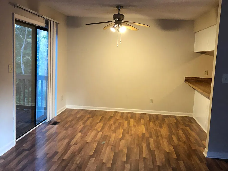 Dining room with sliding door and bar over to kitchen