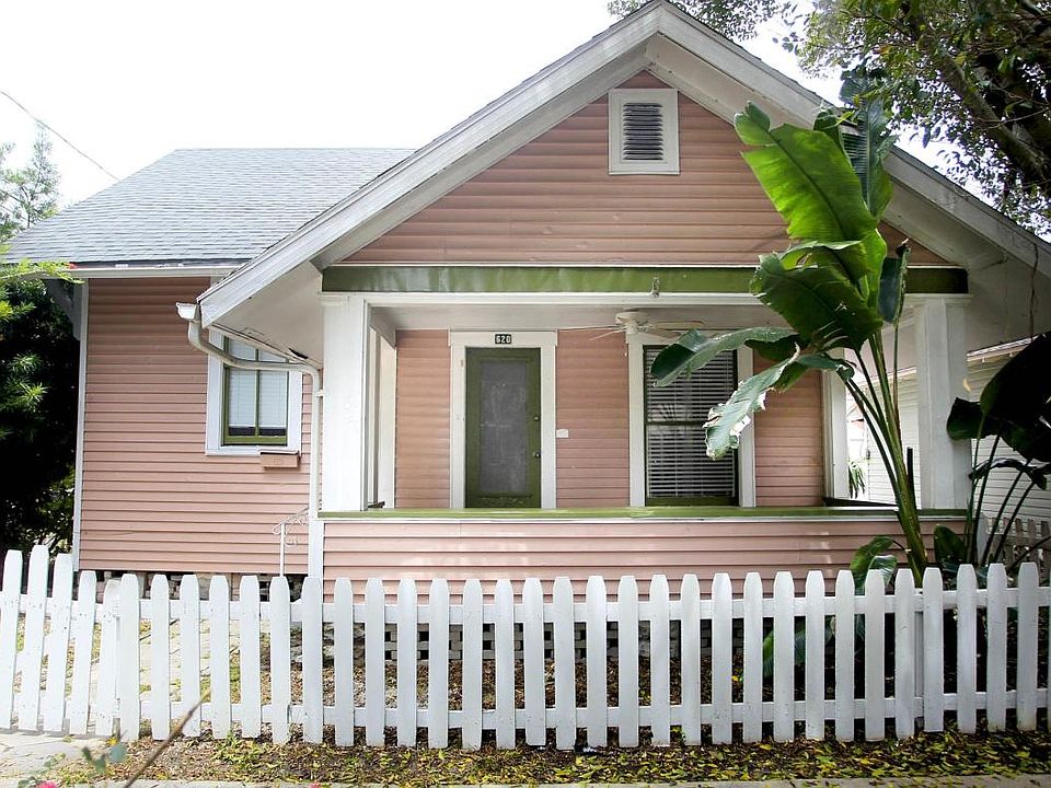 Front porch on a quiet brick street in Historic Uptown