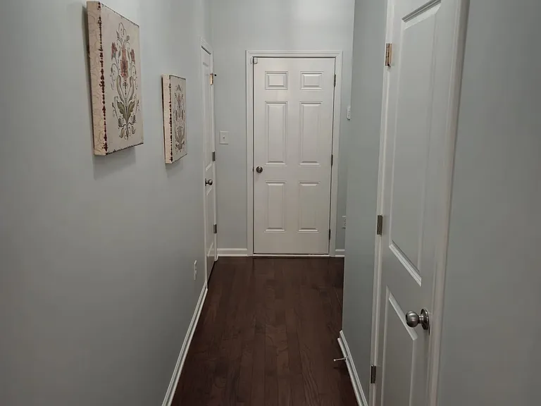 Hallway to the guest bathroom and mudroom.
