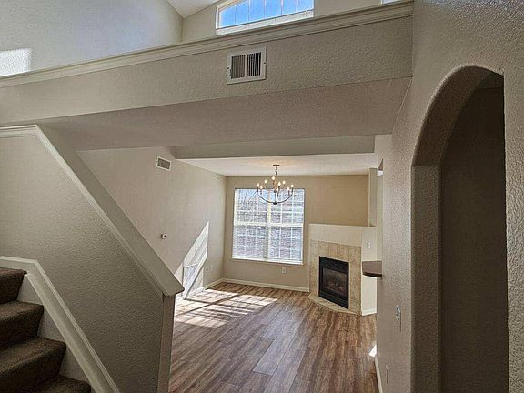 Welcoming front entryway showcasing vaulted ceilings throughout both levels
