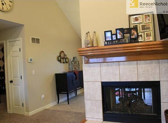 SEE THRU FIREPLACE BETWEEN LIVING ROOM AND HEARTH ROOM.