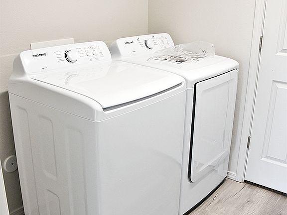 Laundry Room located off garage. Comes quipped with washer and dryer