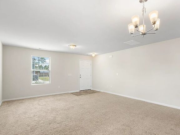 Living Room
___ Bright, open living space with luxury vinyl floors & carpet _ chandelier included!