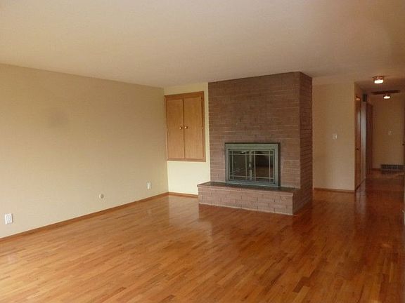 Exposed gleaming oak hardwood floors in living, dining, hallway and bedrooms.