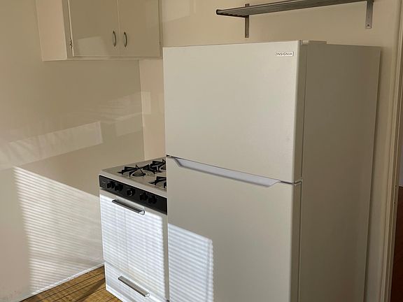 Apartment comes with gas range and refrigerator.