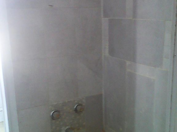 Part 1 of the bathroom with marbleized tile shower
