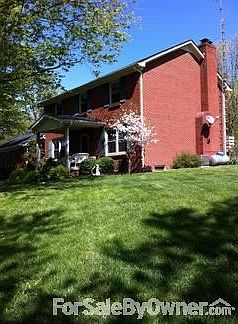 Side View
						:
						Spacious yard with sun and mature trees for shade.