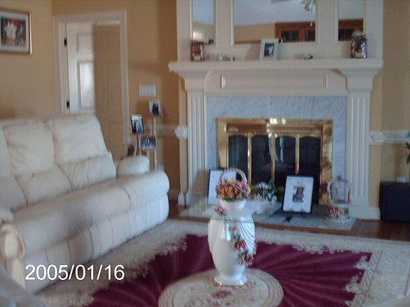 LR, with marble gas fireplace, hardwood floors