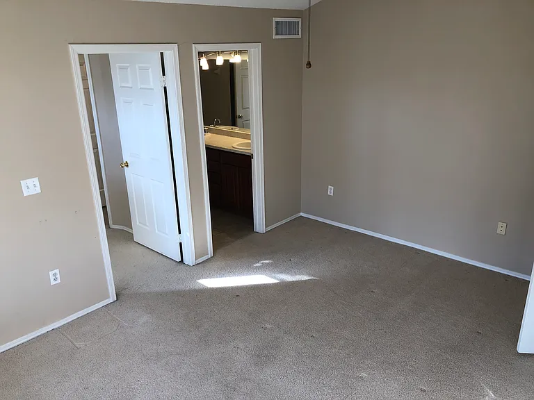 Master Bedroom - walk in closet and walk in bathroom (new carpeting coming!)