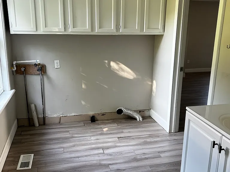 1st bathroom- downstairs- has washer/dryer hookups in this bathroom & extra cabinet space