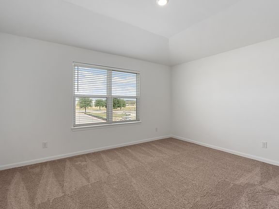 Master bedroom with large windows and enough space for all of your king-size furniture.