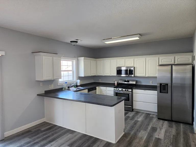 Kitchen; Replace with Stainless appliances and renewed white cabinets