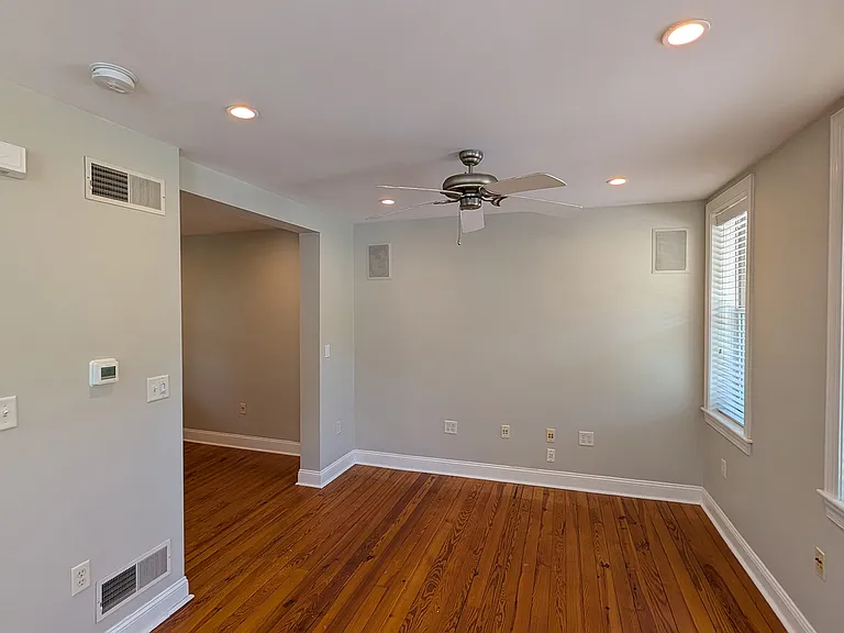 The first floor of the house has a u-shape to it with ample insulated windows on three sides.