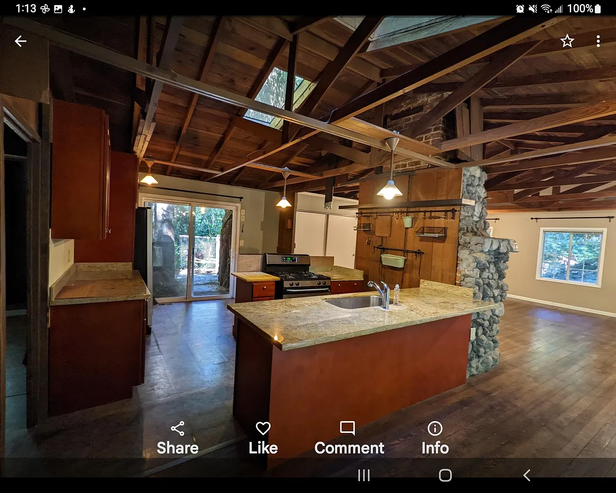 Reverse view across the kitchen to the entryway. Two skylights partially visible. - 8080 La Honda Rd
