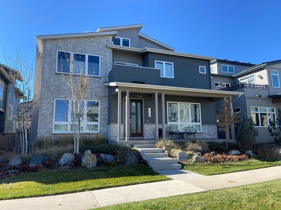 Exterior of home-sits on park.