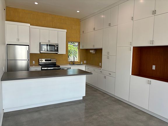 Kitchen, bar and part of living room