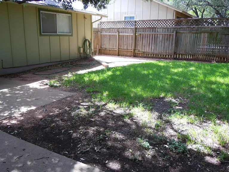 Exterior house is now white walls with black trim.