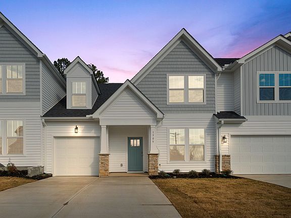 2 Story townhome, white and grey, 1 car garage