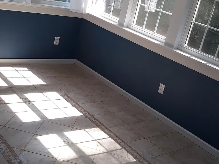 Porch walls are painted indigo blue, like the dining area in the great room.