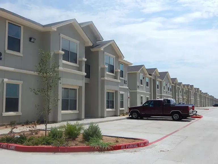 Exterior Apartment Buildings with Parked Truck View - La Joya Apartments in Laredo Texas