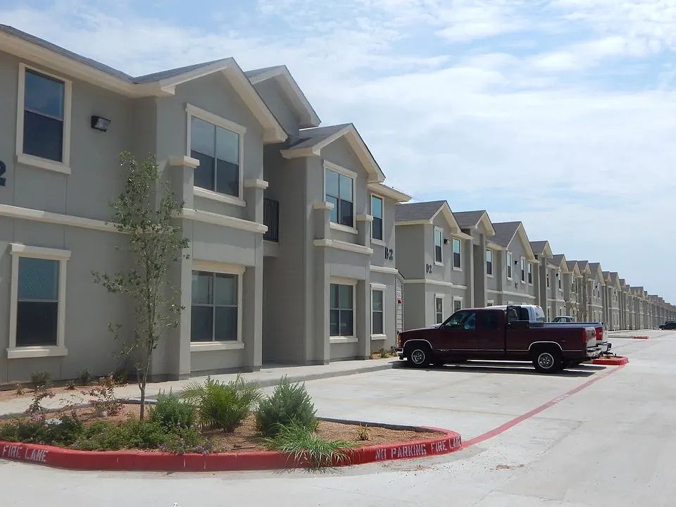 Exterior Apartment Buildings with Parked Truck View - La Joya Apartments in Laredo Texas