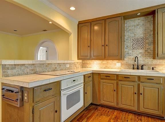kitchen with lots of cabinet space and bar-breakfast/dining