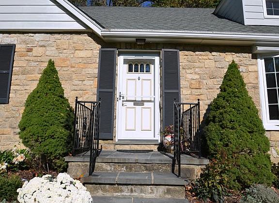 Inviting and charming front stairs and door!