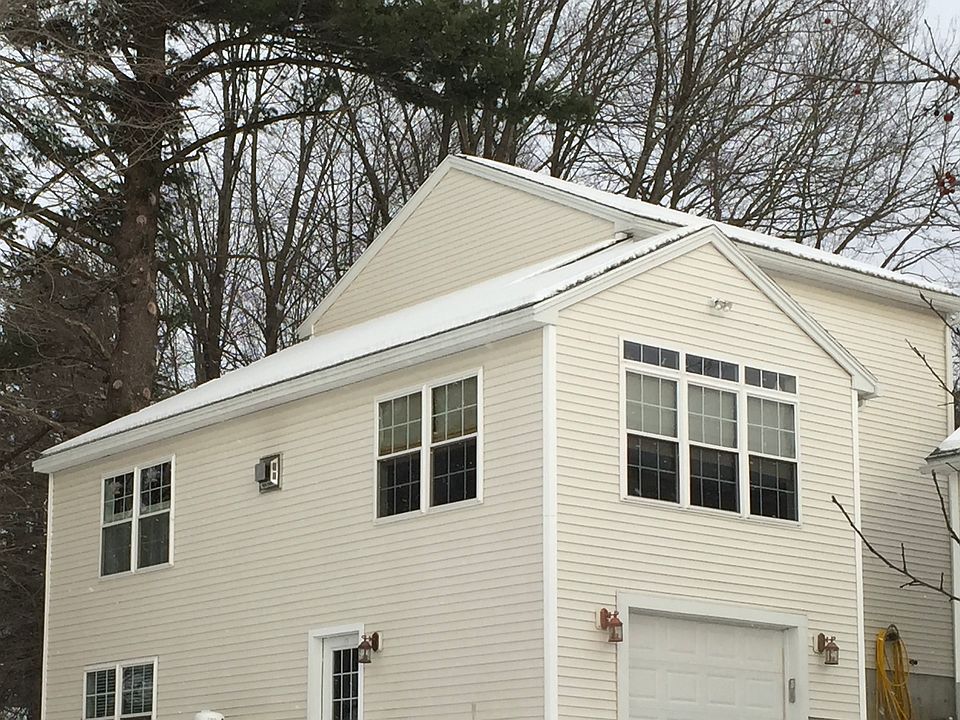 Rear View showing entrance to basement rental unit.