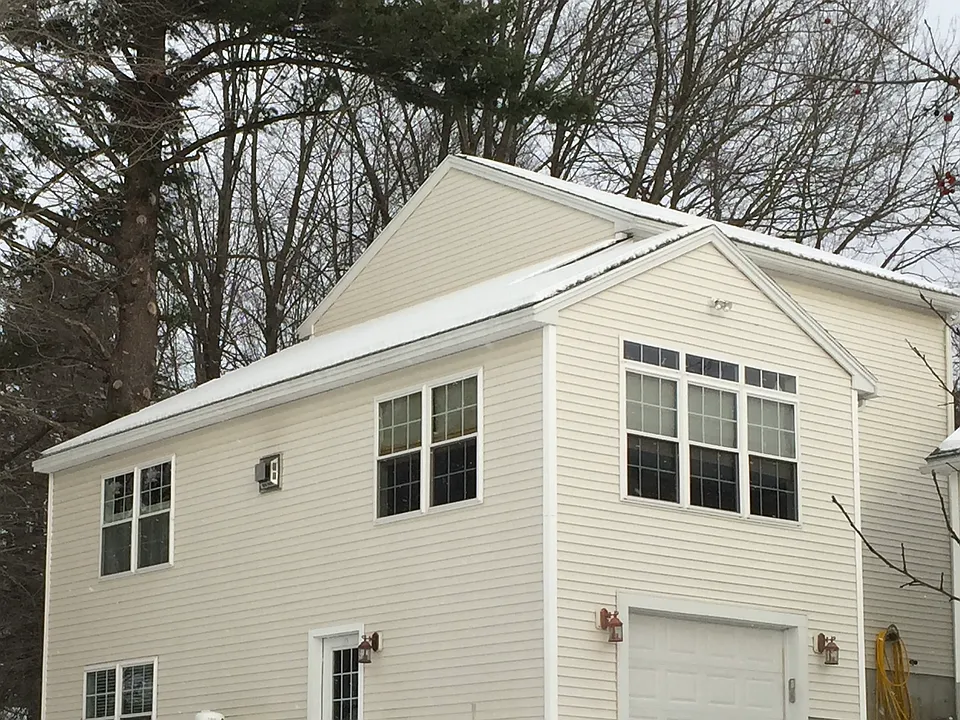 Rear View showing entrance to basement rental unit.