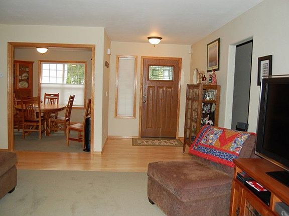 Entrance -Lovely Maple floors. Dining Room on left.
