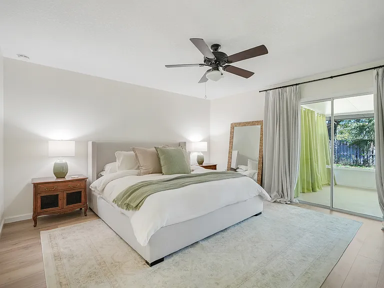Very spacious primary bedroom featuring direct access to the lanai_perfect for enjoying indoor-outdoor living.