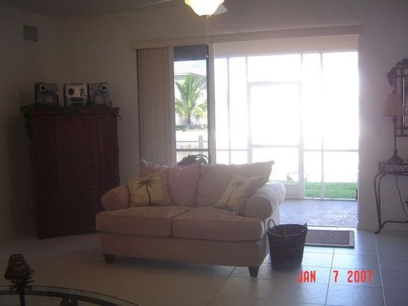 Sliders open up to screened balcony