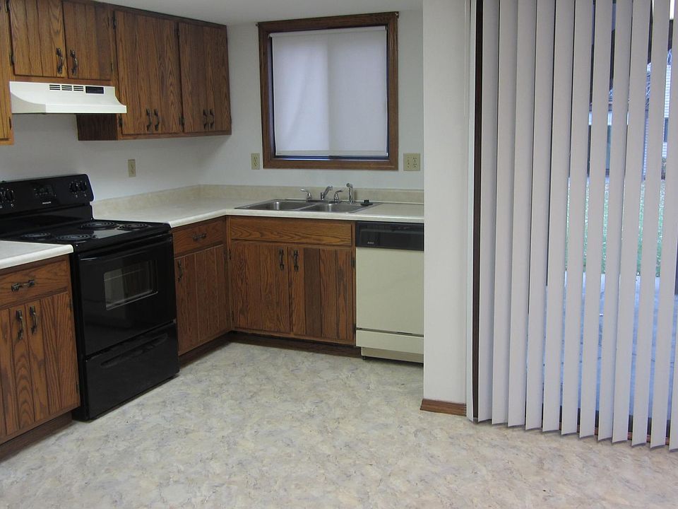 Large eat-in kitchen with lots of cabinets and updated floor