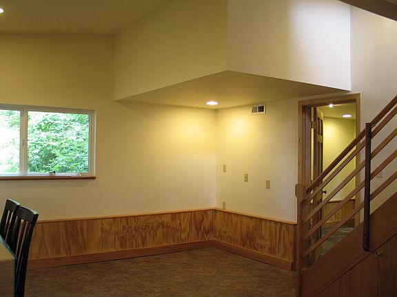 looking northeast, downstairs bedroom through door on right