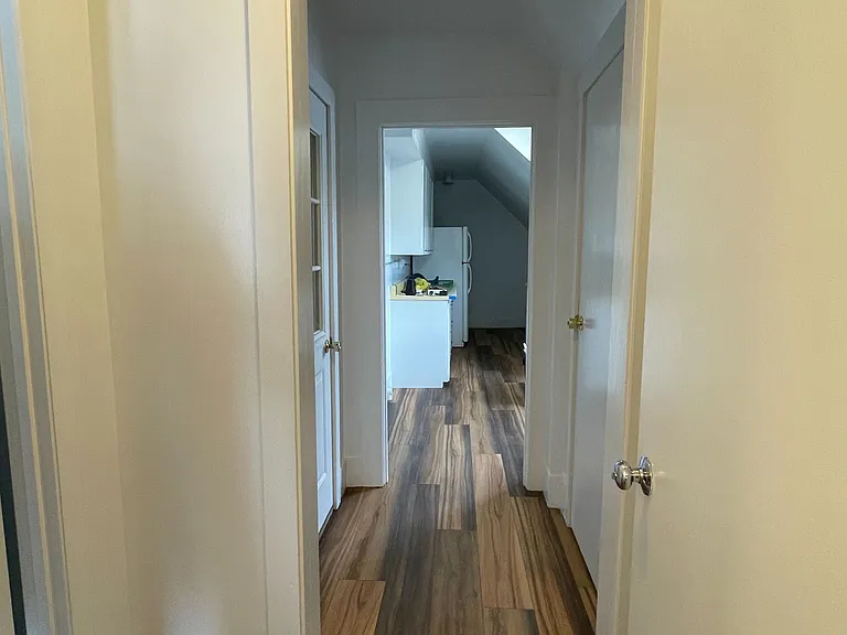hallway from bathroom towards kitchen
