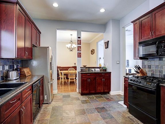Gourmet kitchen with slate floors