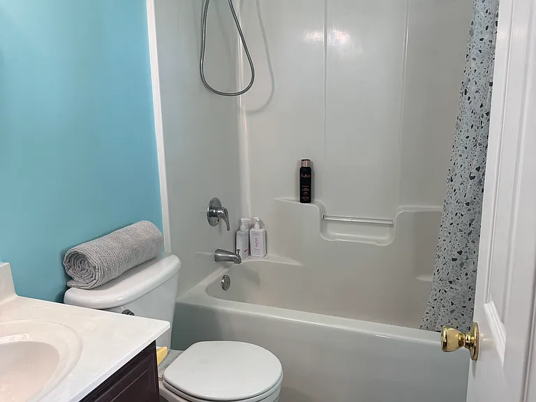 Private primary attached bathroom with clean finishes and a functional layout.