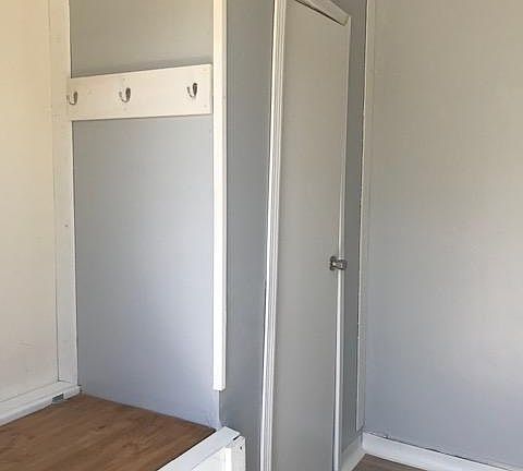 Storage bench, coat hooks, and closet