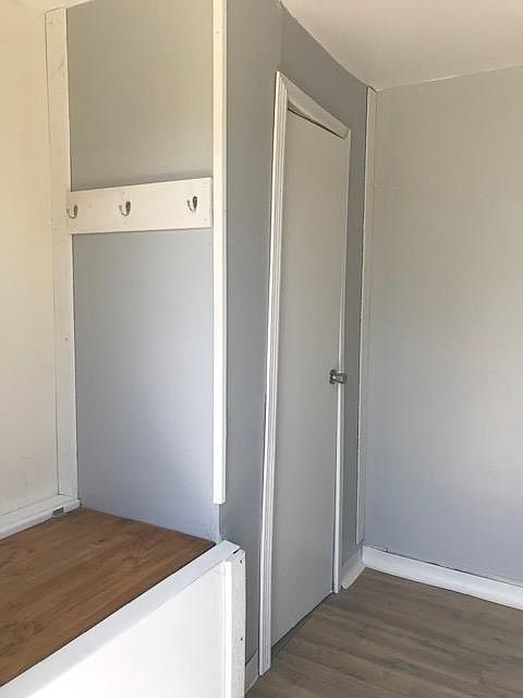 Storage bench, coat hooks, and closet