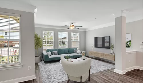 Spacious living rooms with expansive windows - Olde Towne Residences